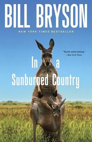 Book cover of 'In a Sunburned Country' by Bill Bryson featuring a kangaroo and a donkey in an Australian landscape.