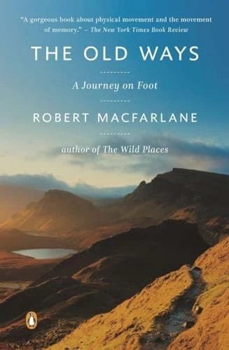 Scenic mountain trail leading through rugged landscape under a blue sky, inspiring outdoor adventure and exploration.